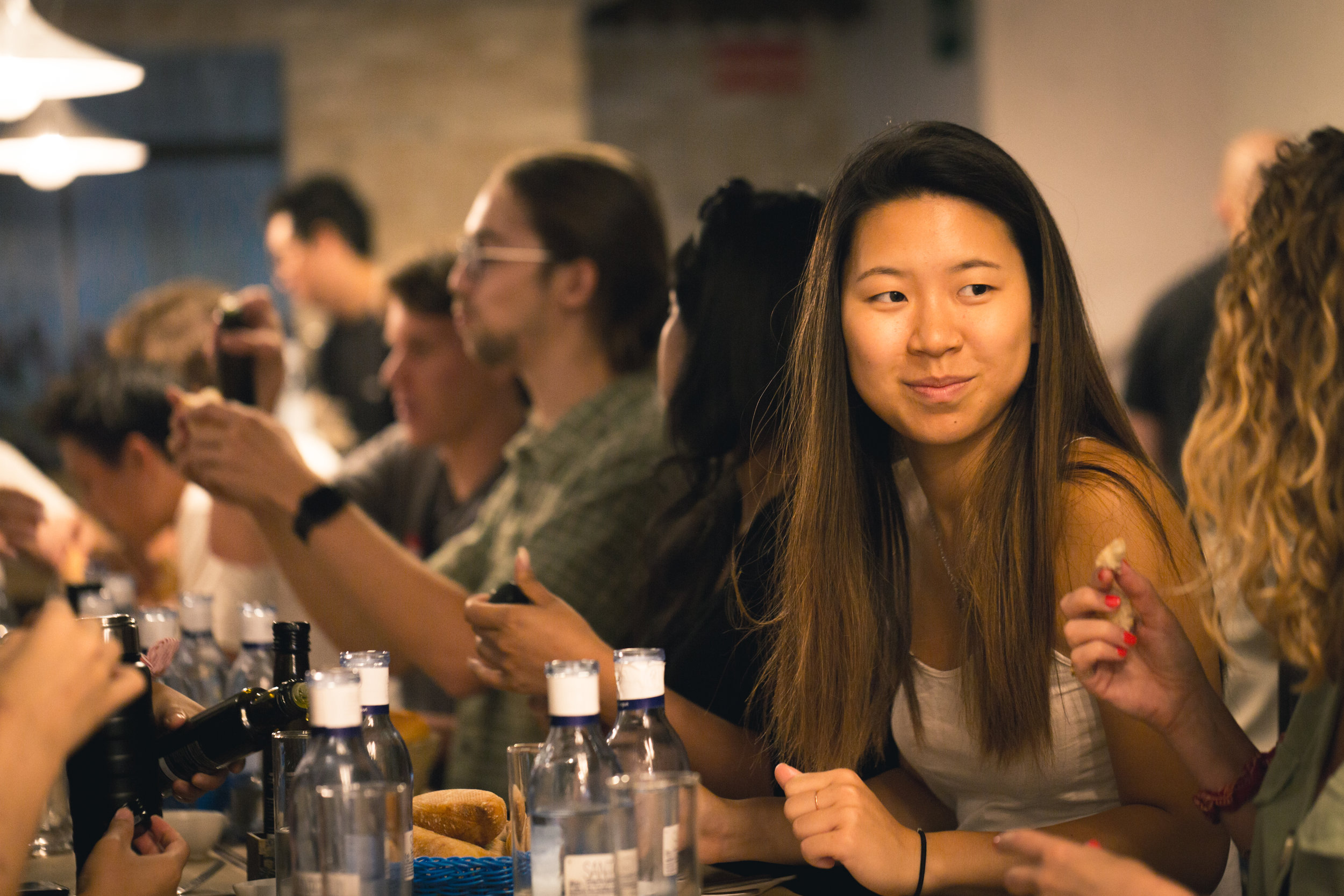 2019 Madrid Fellows enjoy a group meal during a weekend excursion.