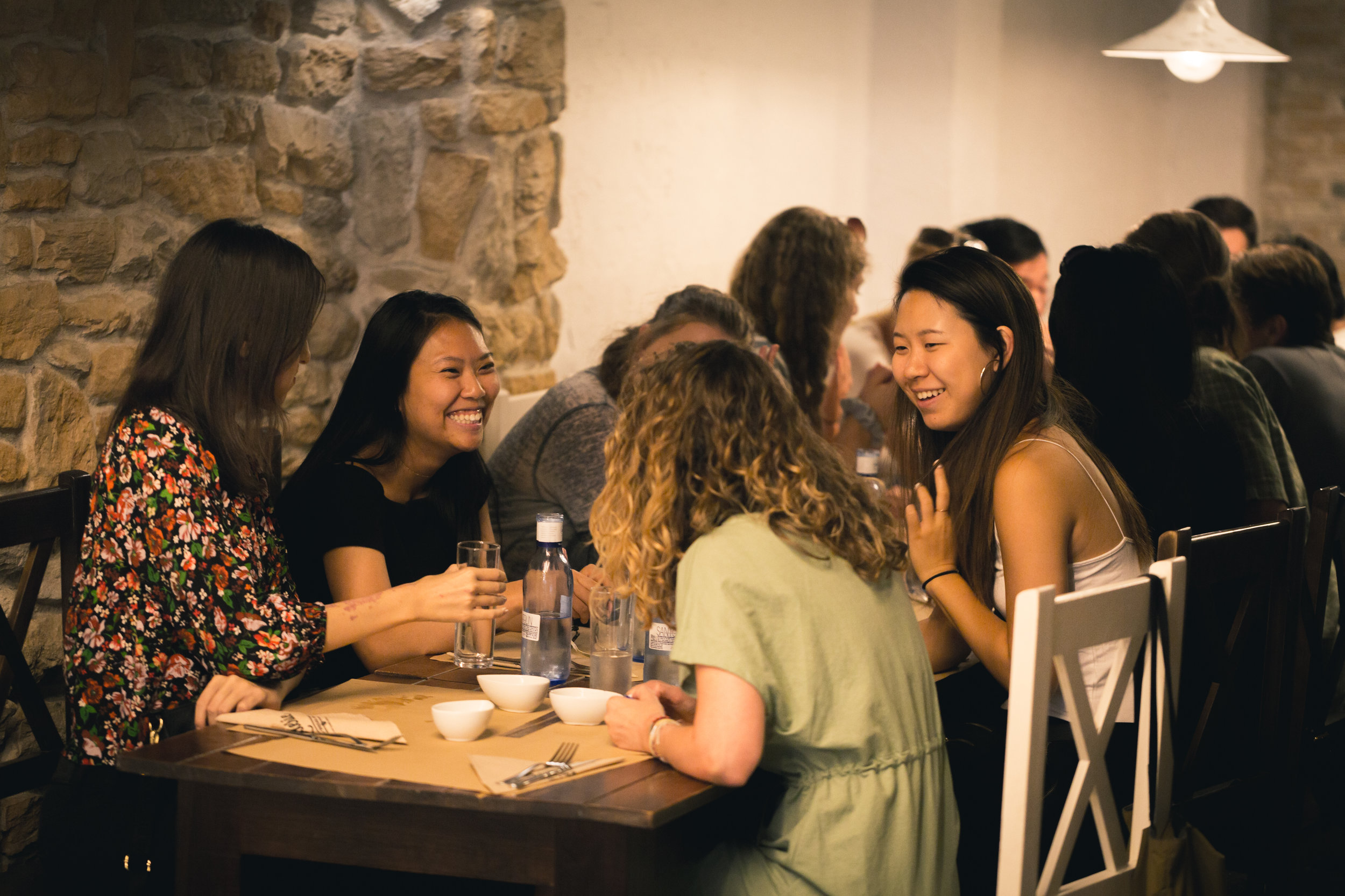 2019 Madrid Fellows enjoy a group meal during a weekend excursion.